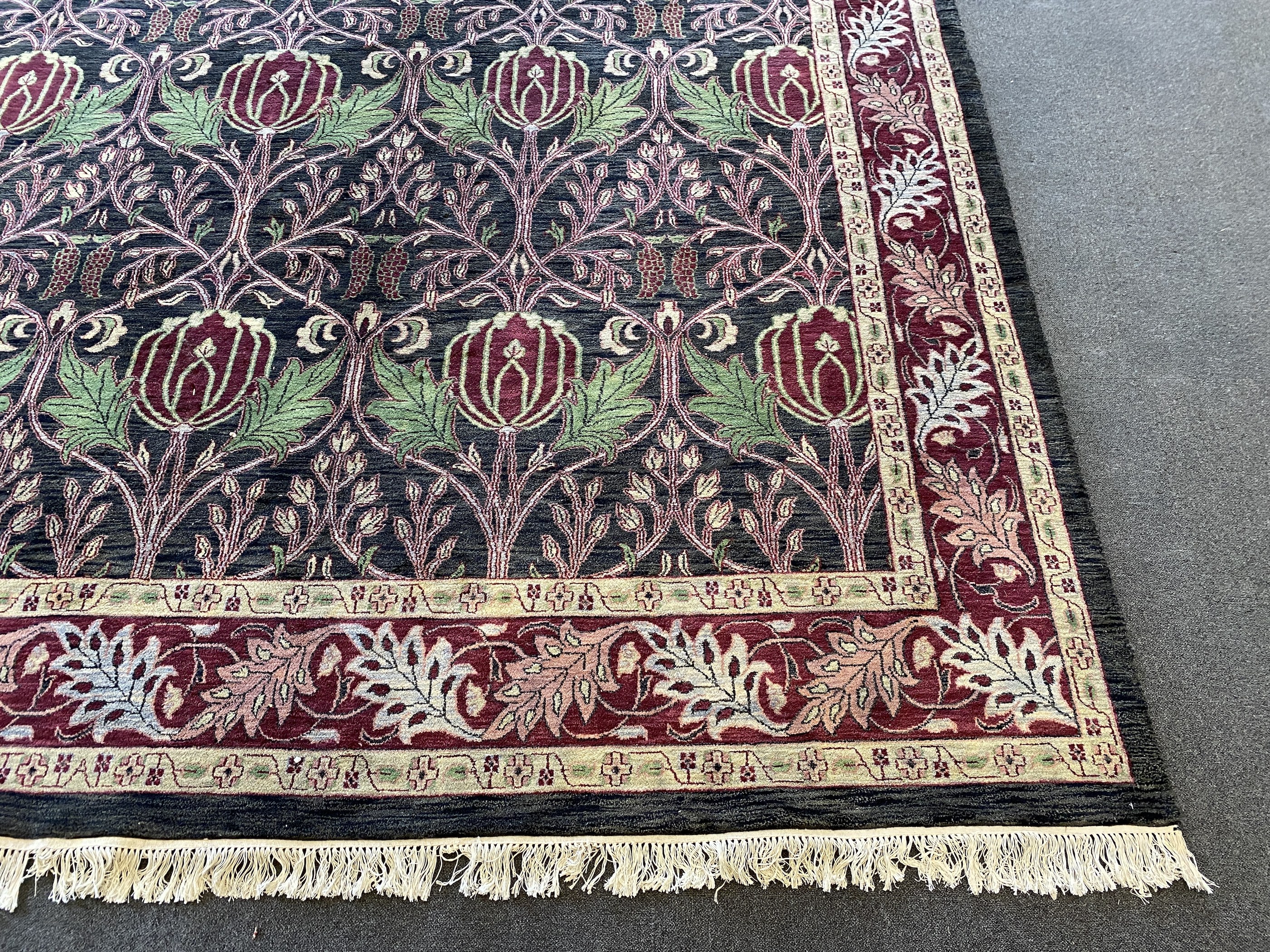 A large Indian Arts & Crafts style carpet, 541 x 358cm